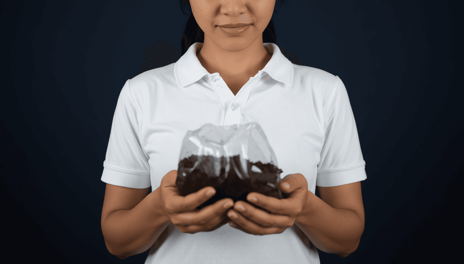 Young Filipino female agriculture student holding a soil sample bag for ALE soil science reviewer Philippines 2026