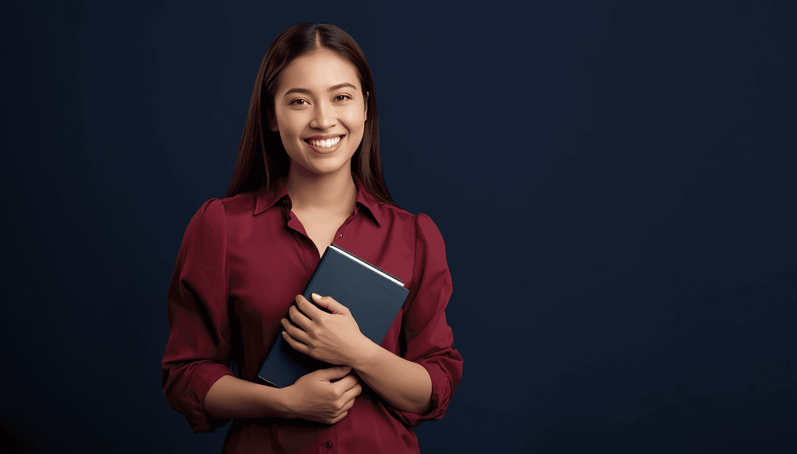 Young Filipino female teacher in maroon blouse holding a book for LET secondary major Filipino reviewer Philippines 2026