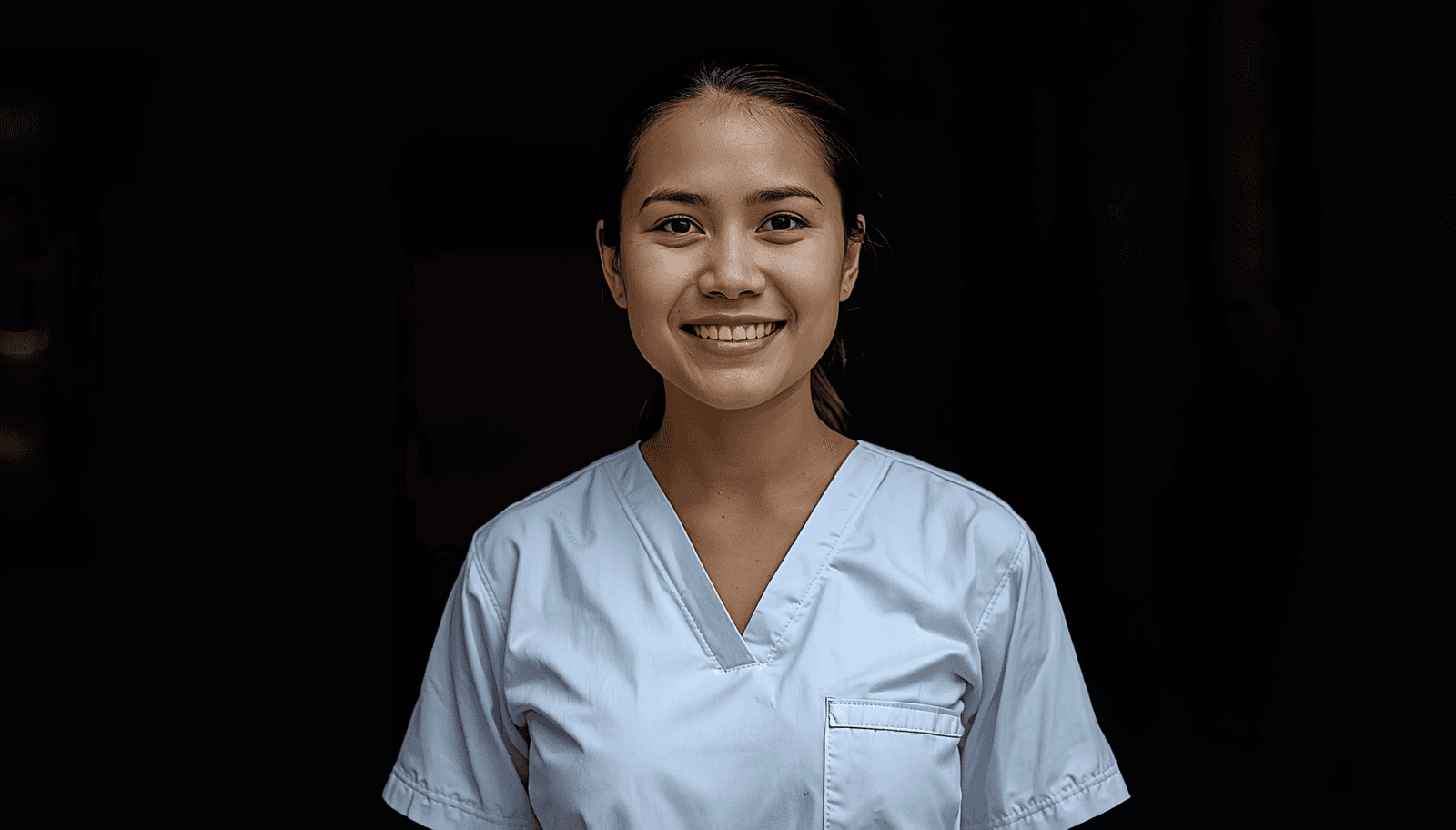 Young Filipino nurse smiling in white scrubs for NLE community health nursing reviewer Philippines 2026