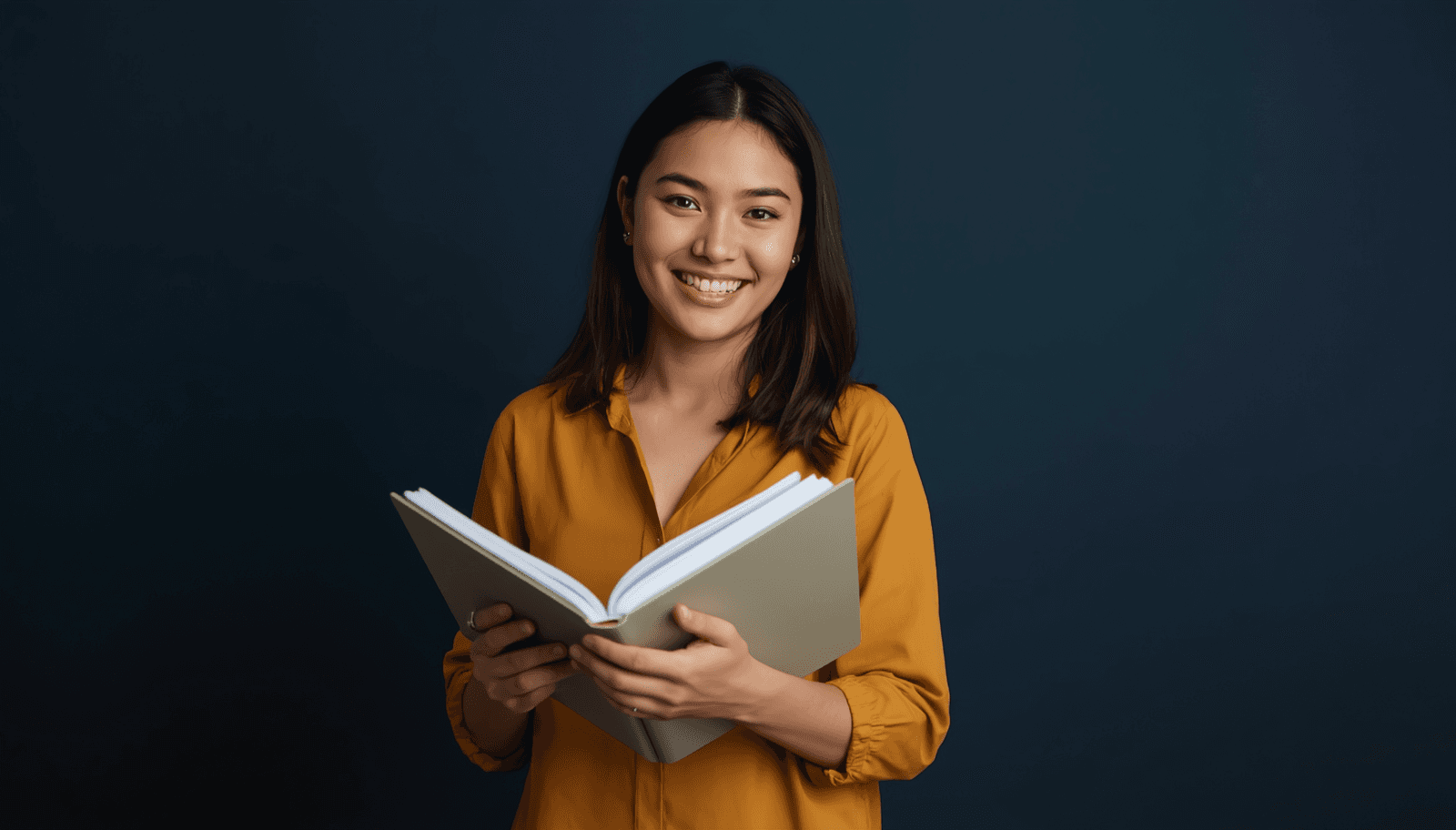Young Filipino female student in mustard blouse holding open planner for PRC board exam schedule 2026 Philippines